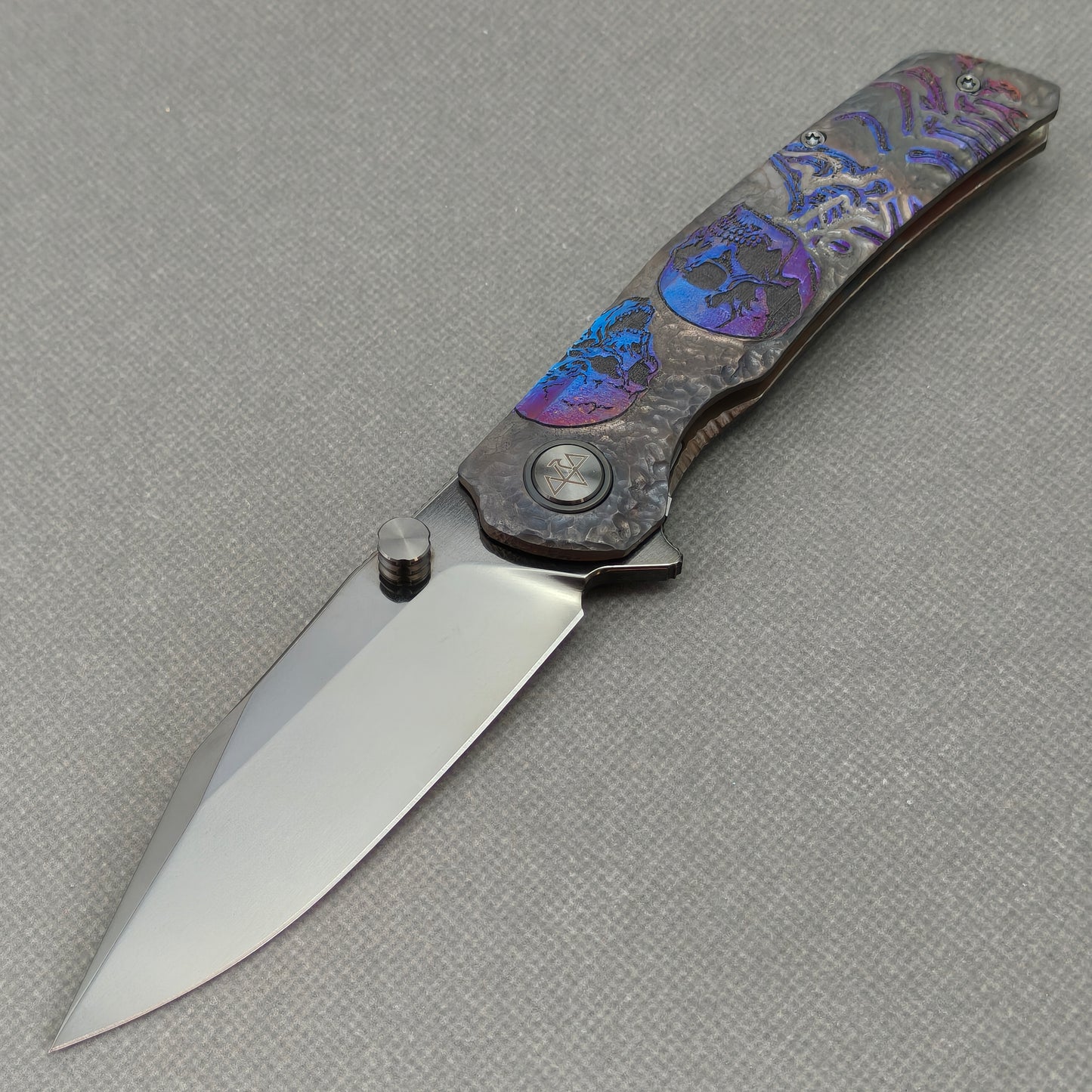 VORIXN Skull Nocturne KB120 Folding Knife – open non-clip side view showing hand-engraved anodized titanium handle and M390 blade profile
