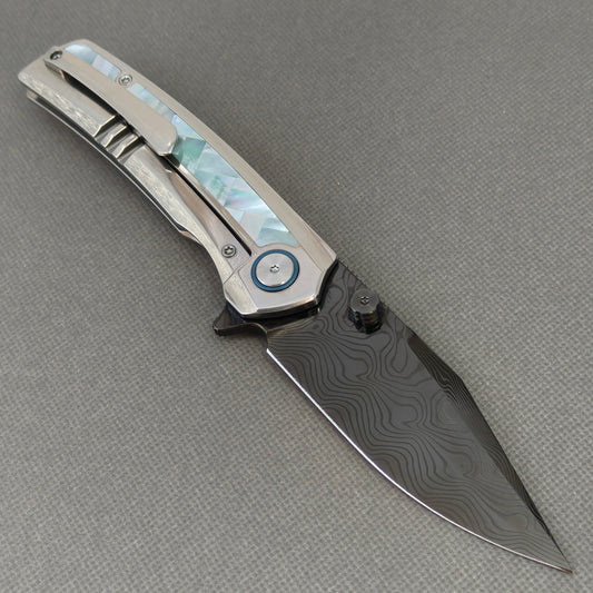 VORIXN KB104 Ocean Mirage Folding Knife – open clip side view showing pocket clip and Mother-of-Pearl Inlaid Titanium handle