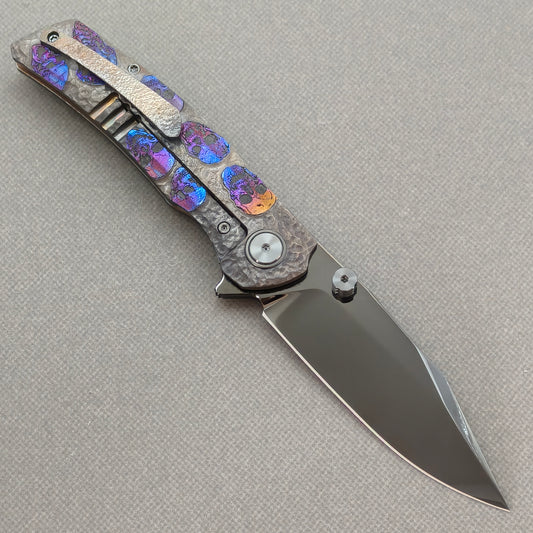 VORIXN Skull Nocturne KB120 Folding Knife – open clip side view showing pocket clip and hand-engraved anodized titanium handle