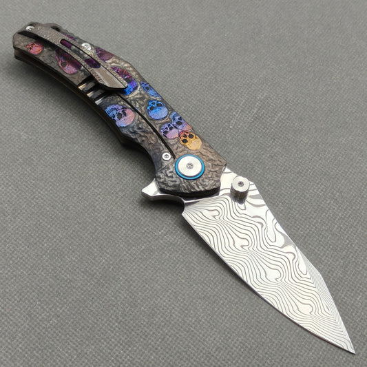 VORIXN “Skull Rift” Flipper & Thumb Stud Knife Titanium-Engraved Anodized Coloring Handle (3.5" Damascus Blade) KB096