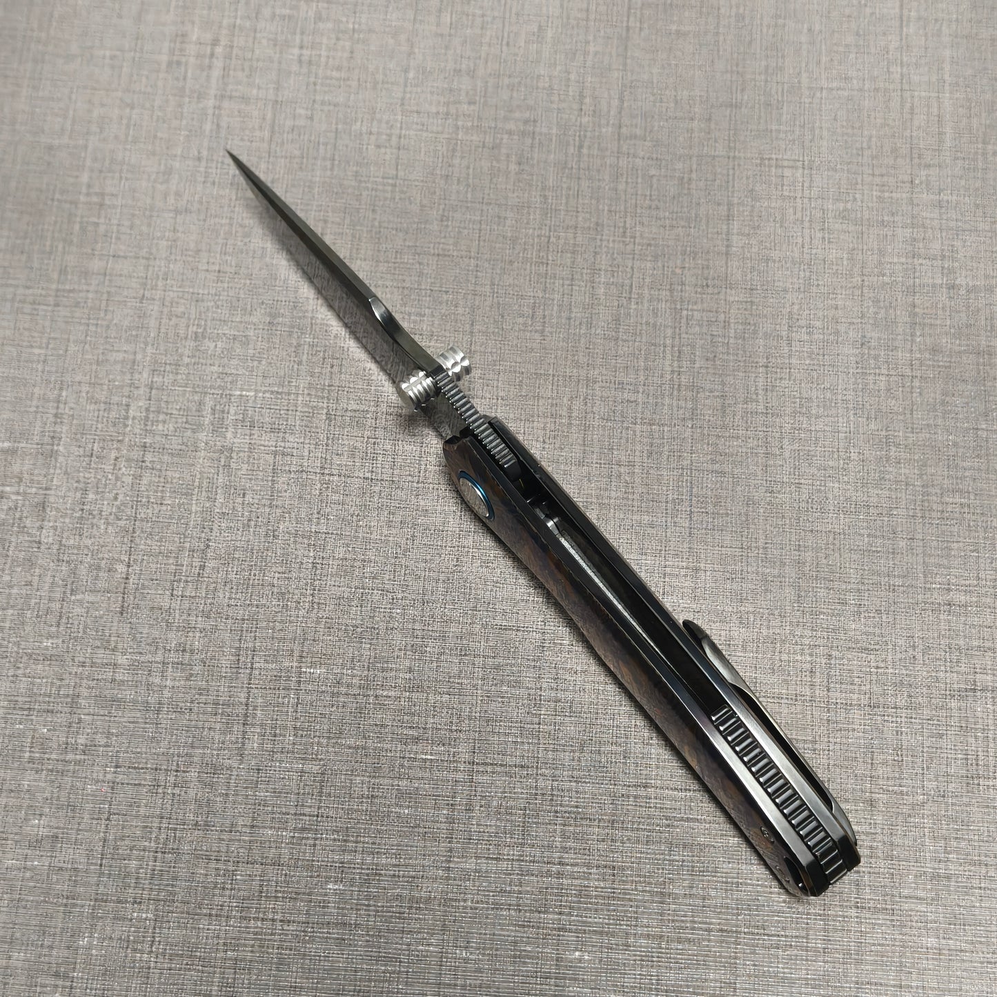 VORIXN Topograph folding knife open, top-down view from the spine showing blade alignment