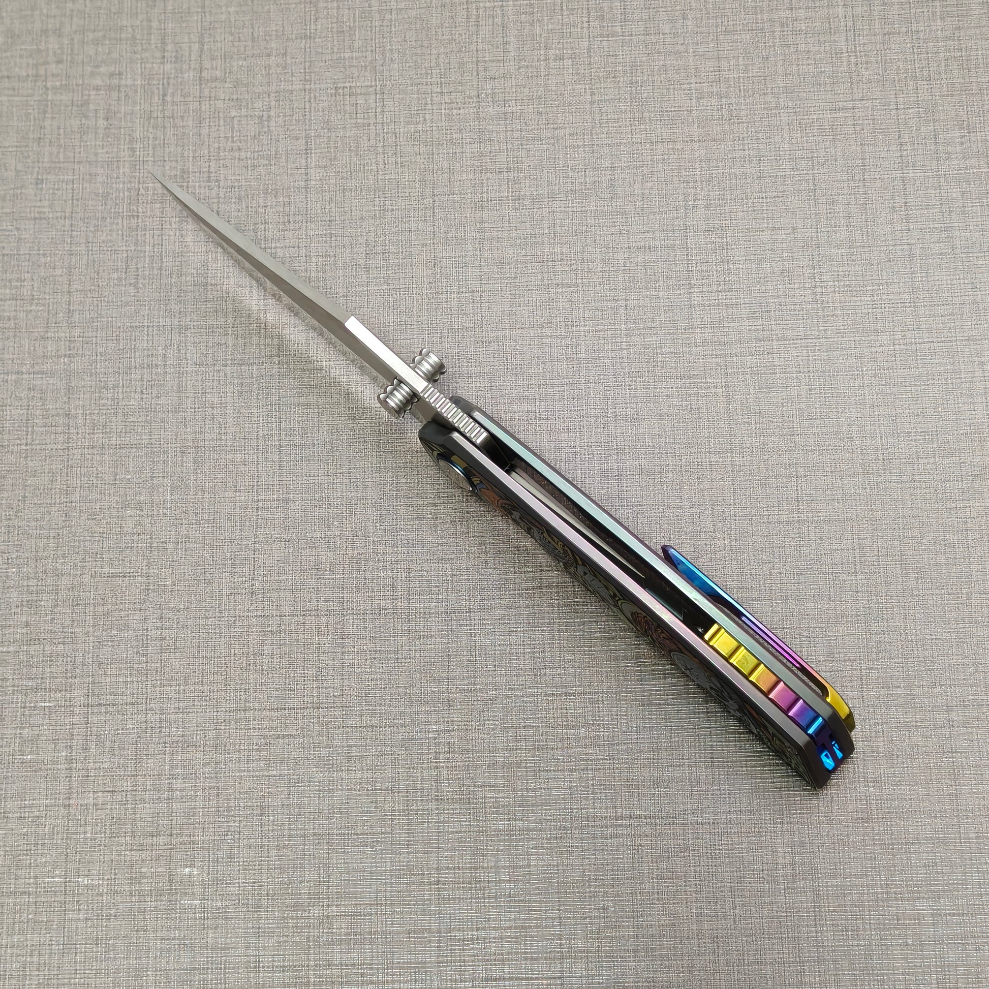 VORIXN Timeless folding knife open, top-down spine view showing blade alignment