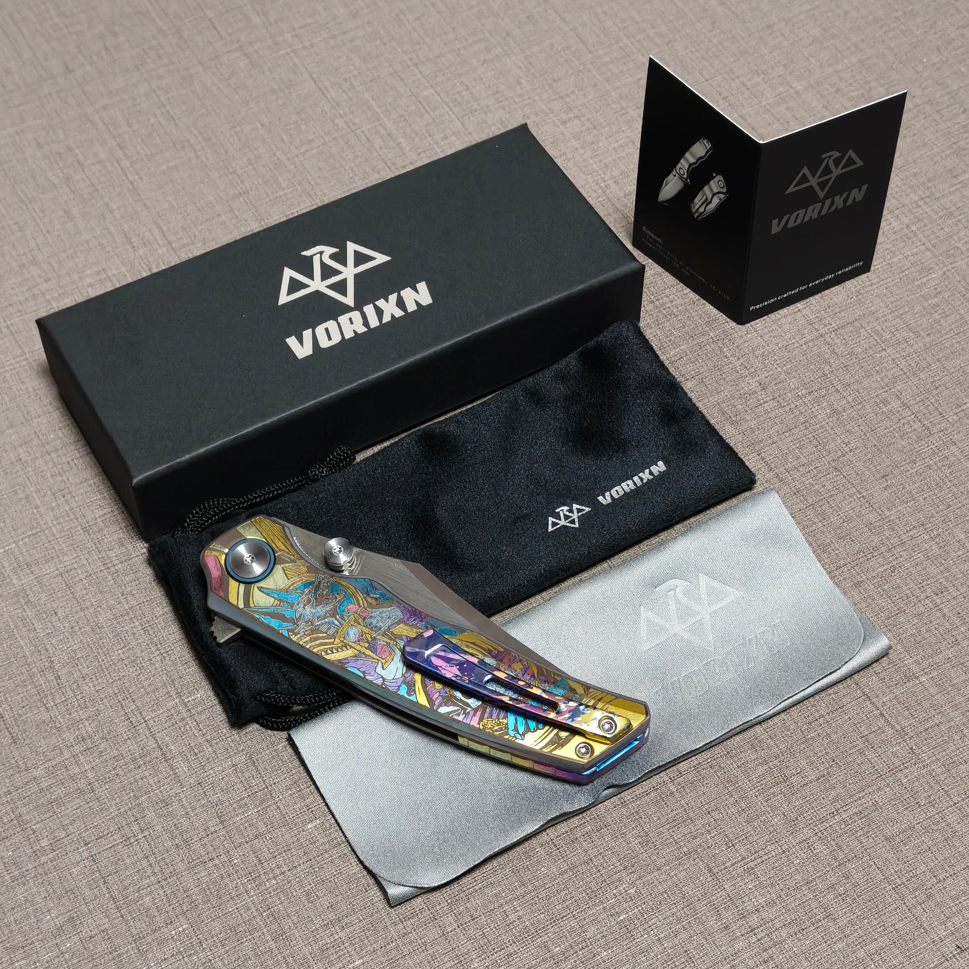 VORIXN folding knife packaging including drawstring pouch, care instruction card, and microfiber cleaning cloth
