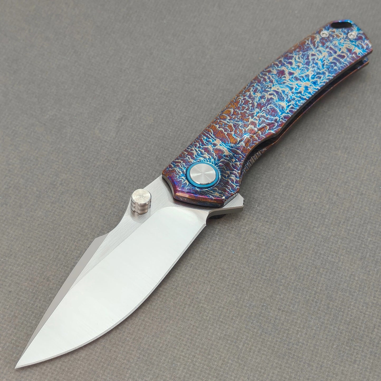 VORIXN KB051 Aetherflame 10Cr15CoMoV folding knife open non-clip side view with hand-flamed titanium handle and overall profile.