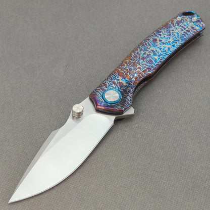 VORIXN KB051 Aetherflame 10Cr15CoMoV folding knife open non-clip side view with hand-flamed titanium handle and overall profile.