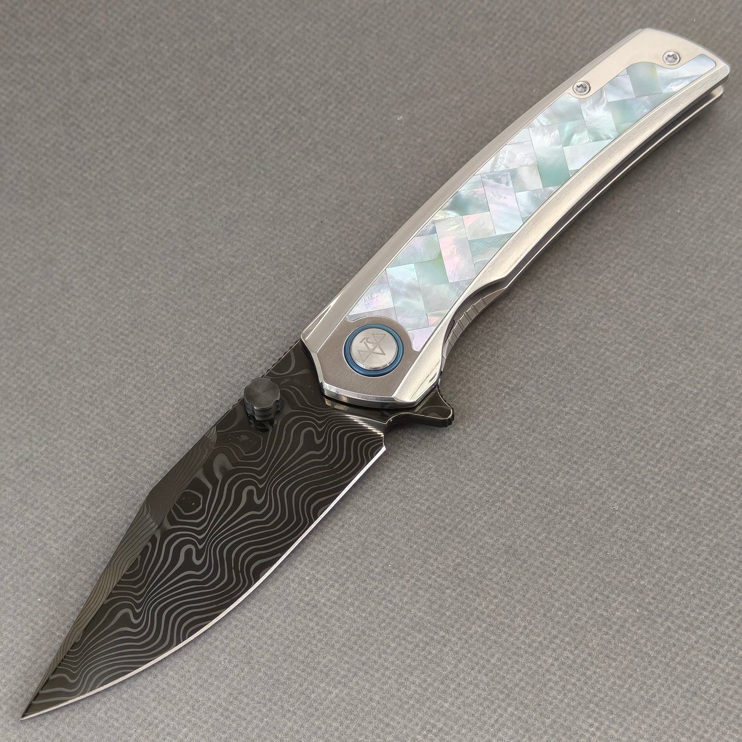 VORIXN Ocean Mirage KB104 Folding Knife – open non-clip side view showing White Mother-of-Pearl Inlaid Titanium handle and Damascus DLC-Coated blade profile