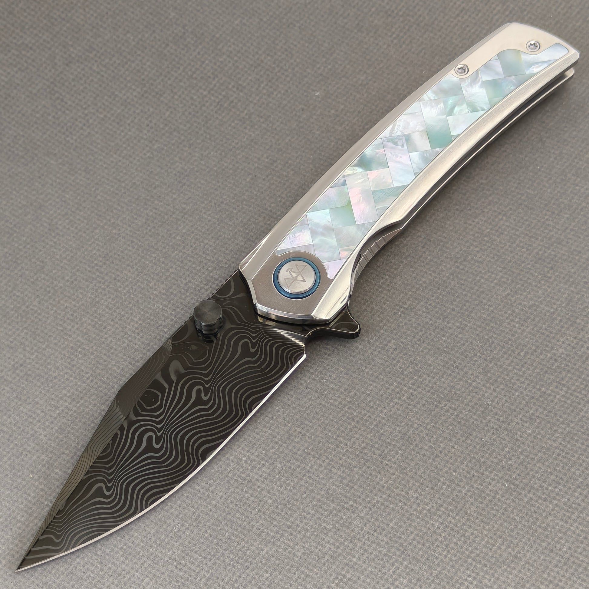 VORIXN Ocean Mirage KB104 Folding Knife – open non-clip side view showing White Mother-of-Pearl Inlaid Titanium handle and Damascus DLC-Coated blade profile