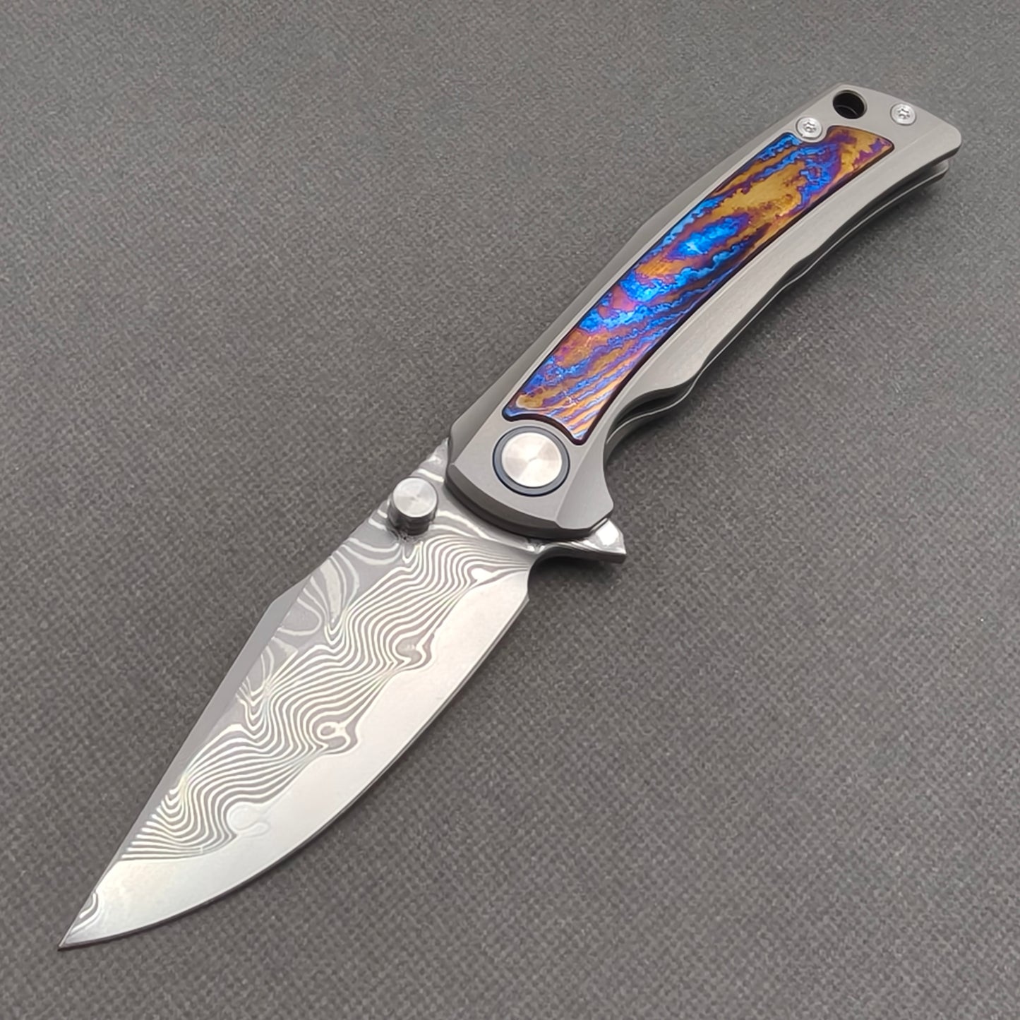 VORIXN KB019 Nebula Damascus folding knife open non-clip side view with titanium and zirconium inlay handle and overall profile.