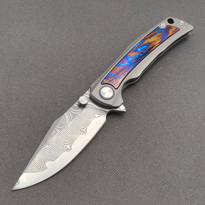 VORIXN KB019 Nebula Damascus folding knife open non-clip side view with titanium and zirconium inlay handle and overall profile.