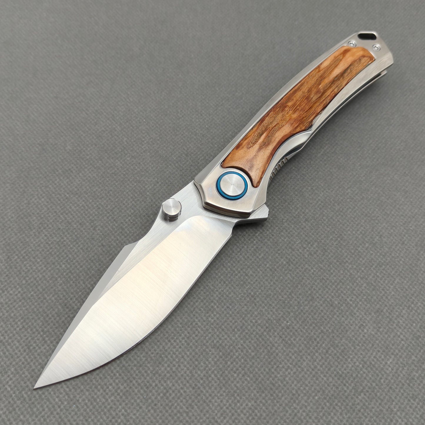 VORIXN KB043 Auron 10Cr15CoMoV folding knife open non-clip side view with titanium and natural stag inlay handle and overall profile.
