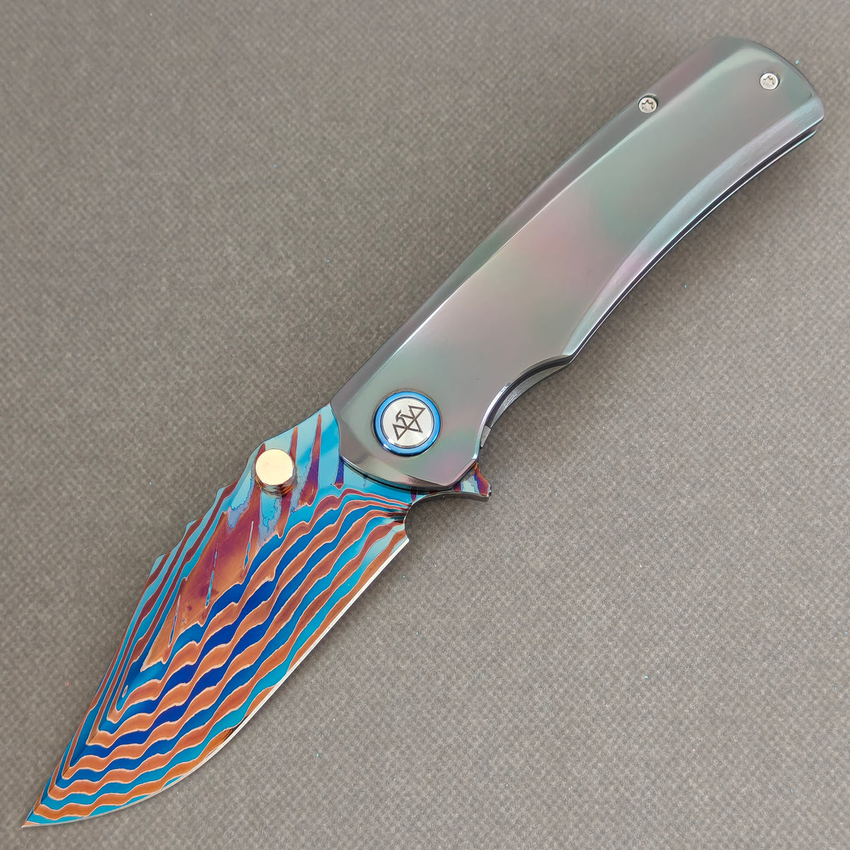 VORIXN Steelwraith KB143 Folding Knife – open non-clip side view showing Zirconium handle and Damascus blade profile.