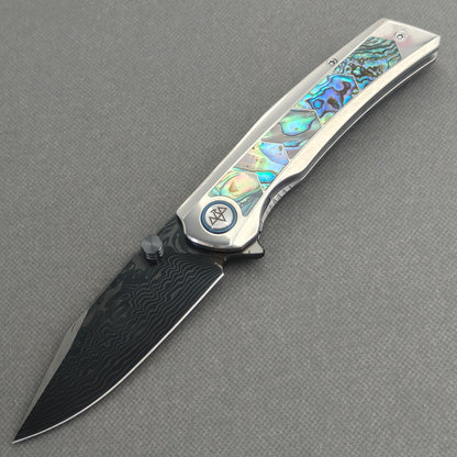 VORIXN Ocean Mirage KB130 Folding Knife – open non-clip side view showing deep-sea abalone shell inlay titanium handle and Damascus blade profile