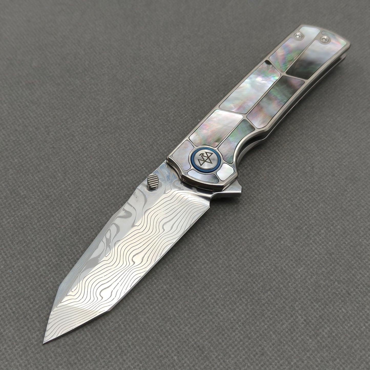 VORIXN KB059 Ocean Mirage Damascus folding knife open non-clip side view with black mother-of-pearl inlaid titanium handle and overall profile.