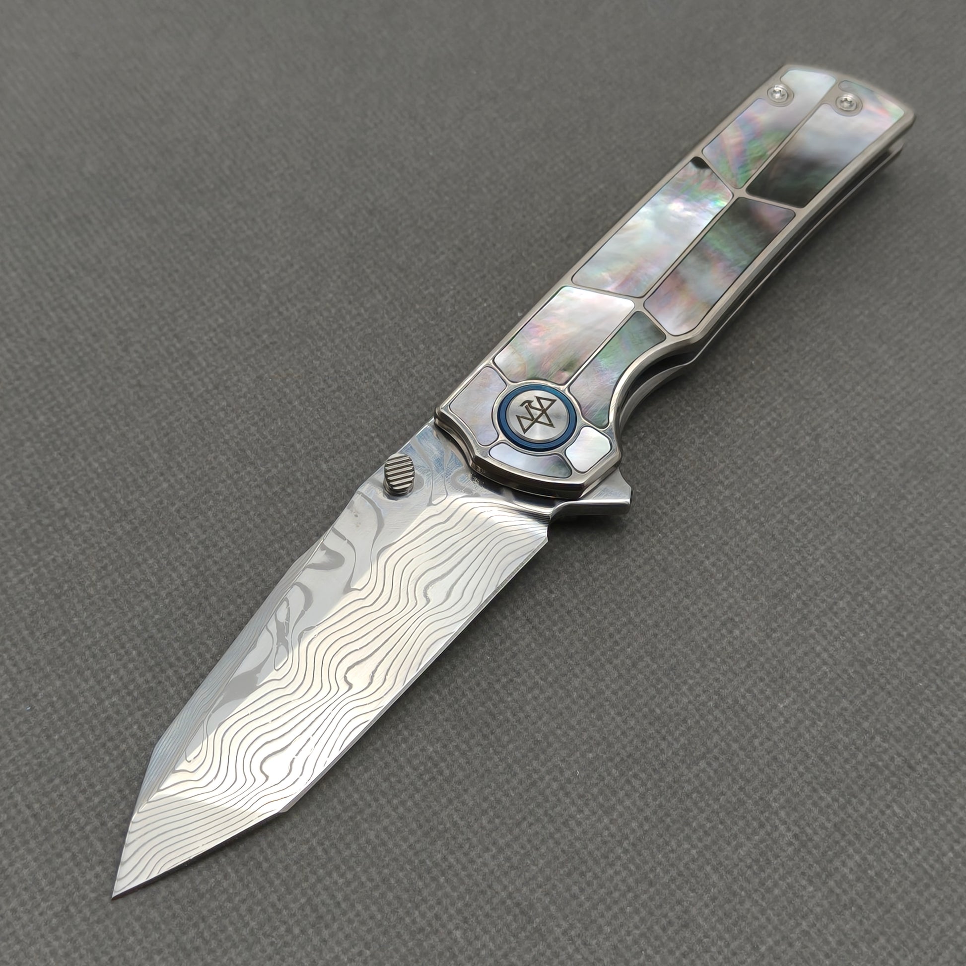 VORIXN KB059 Ocean Mirage Damascus folding knife open non-clip side view with black mother-of-pearl inlaid titanium handle and overall profile.