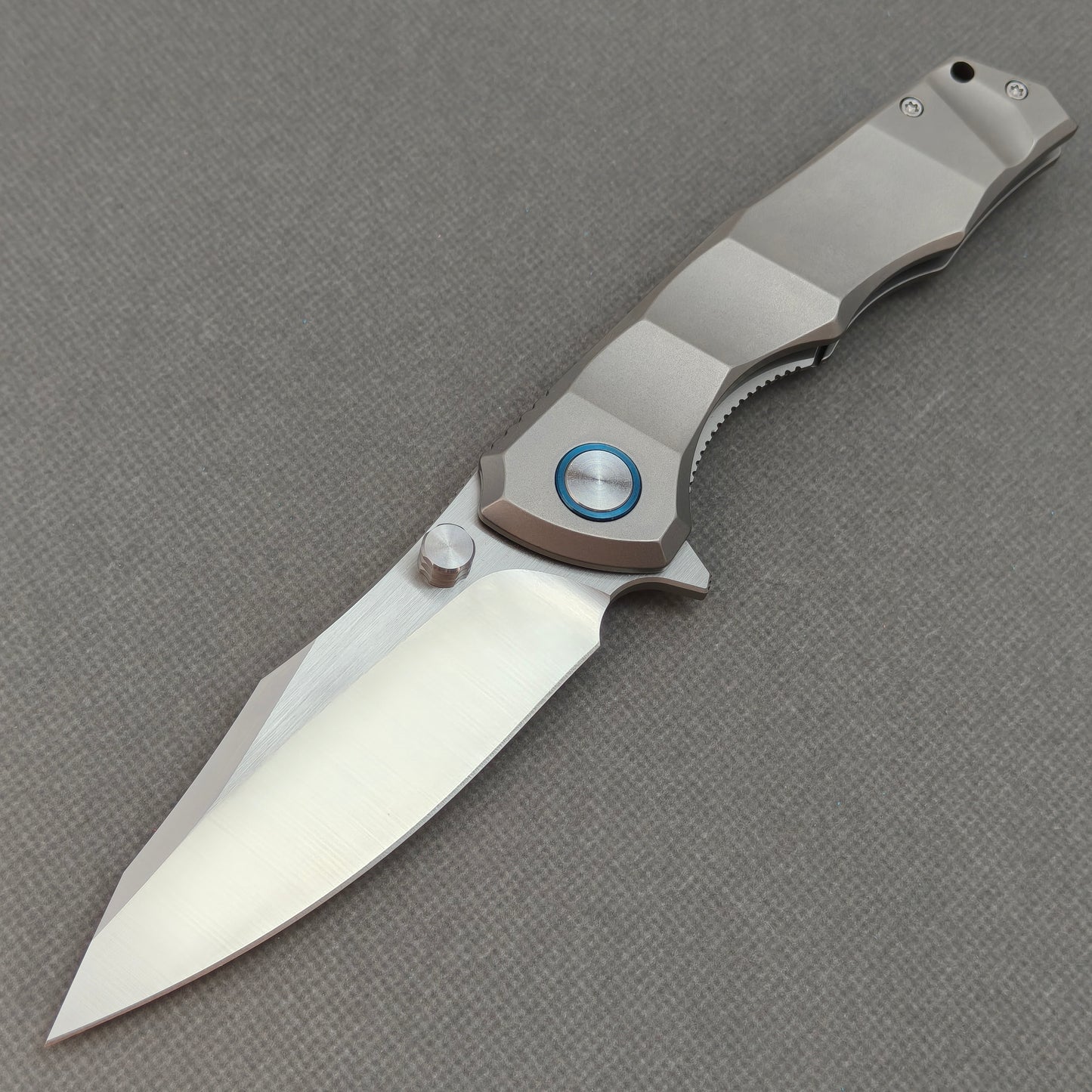 VORIXN KB014 Aegis Titan 10Cr15CoMoV titanium folding knife open non-clip side view with brushed blade and overall profile.