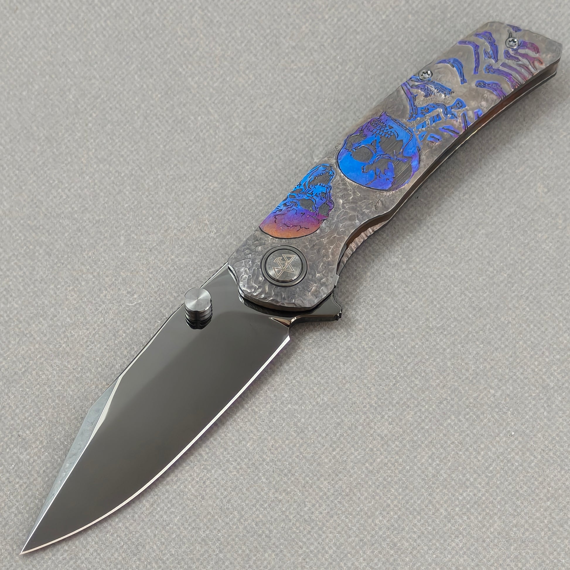VORIXN Skull Nocturne KB120 Folding Knife – open non-clip side view showing hand-engraved anodized titanium handle and M390 blade profile