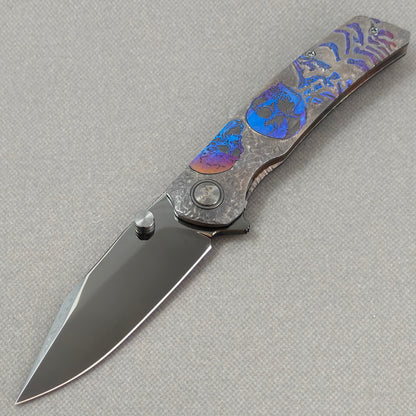 VORIXN Skull Nocturne KB120 Folding Knife – open non-clip side view showing hand-engraved anodized titanium handle and M390 blade profile