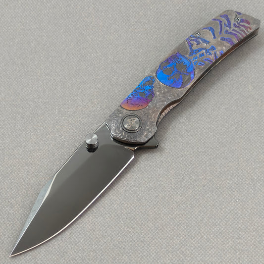 VORIXN Skull Nocturne KB120 Folding Knife – open non-clip side view showing hand-engraved anodized titanium handle and M390 blade profile