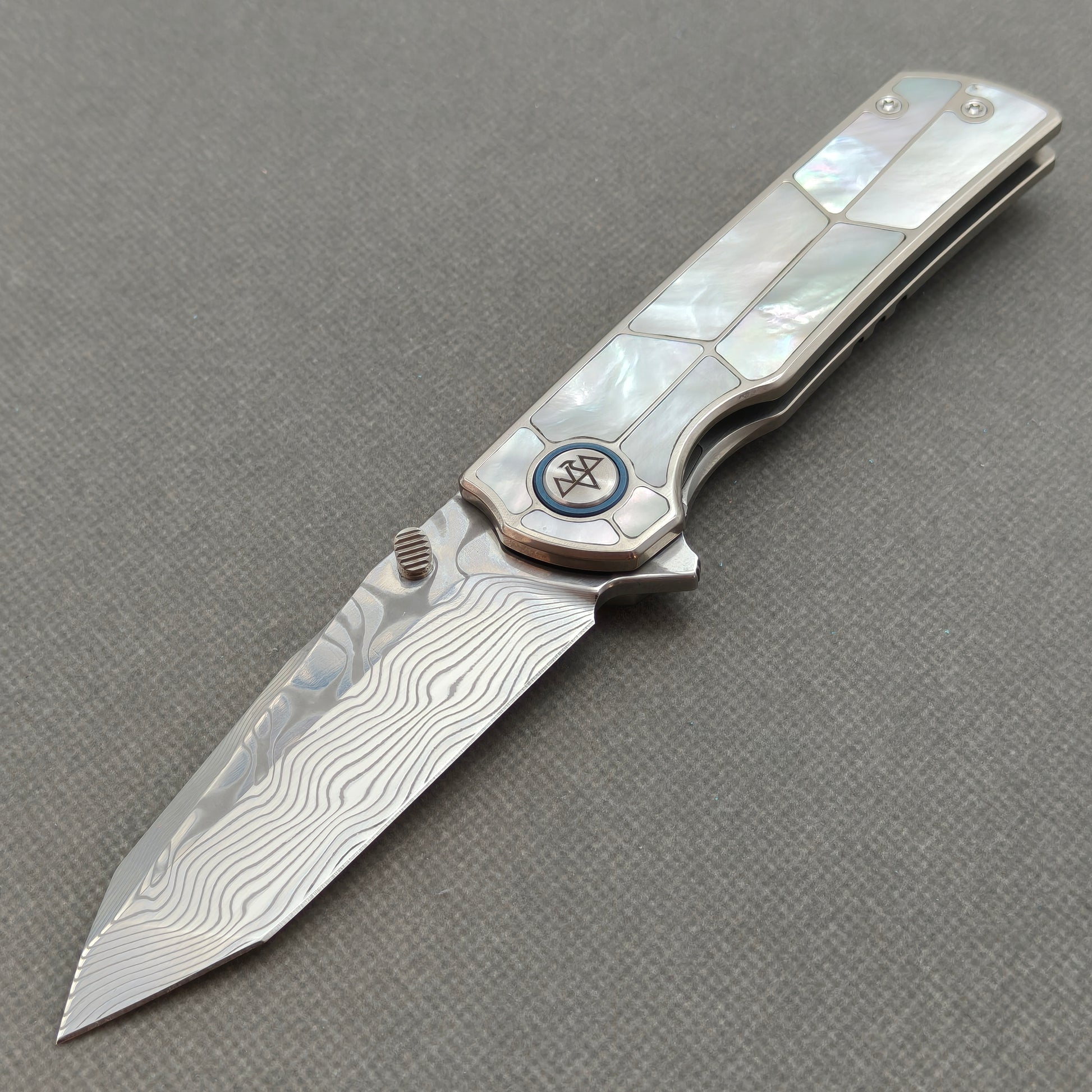 VORIXN KB063 Ocean Mirage Damascus folding knife open non-clip side view with white mother-of-pearl inlaid titanium handle and overall profile.