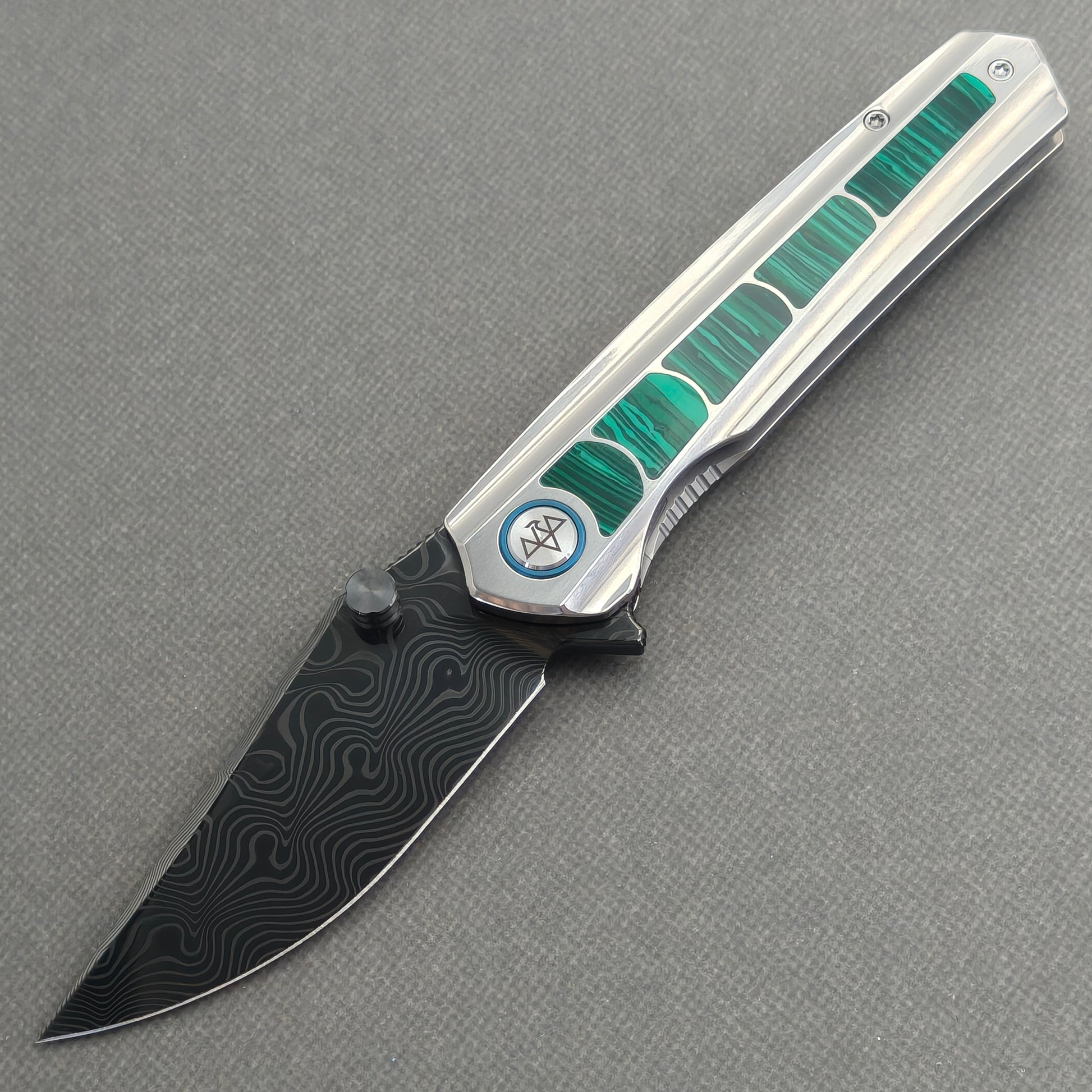 VORIXN Forest Mirage KB131 Folding Knife – open non-clip side view showing malachite inlaid titanium handle and Damascus blade profile