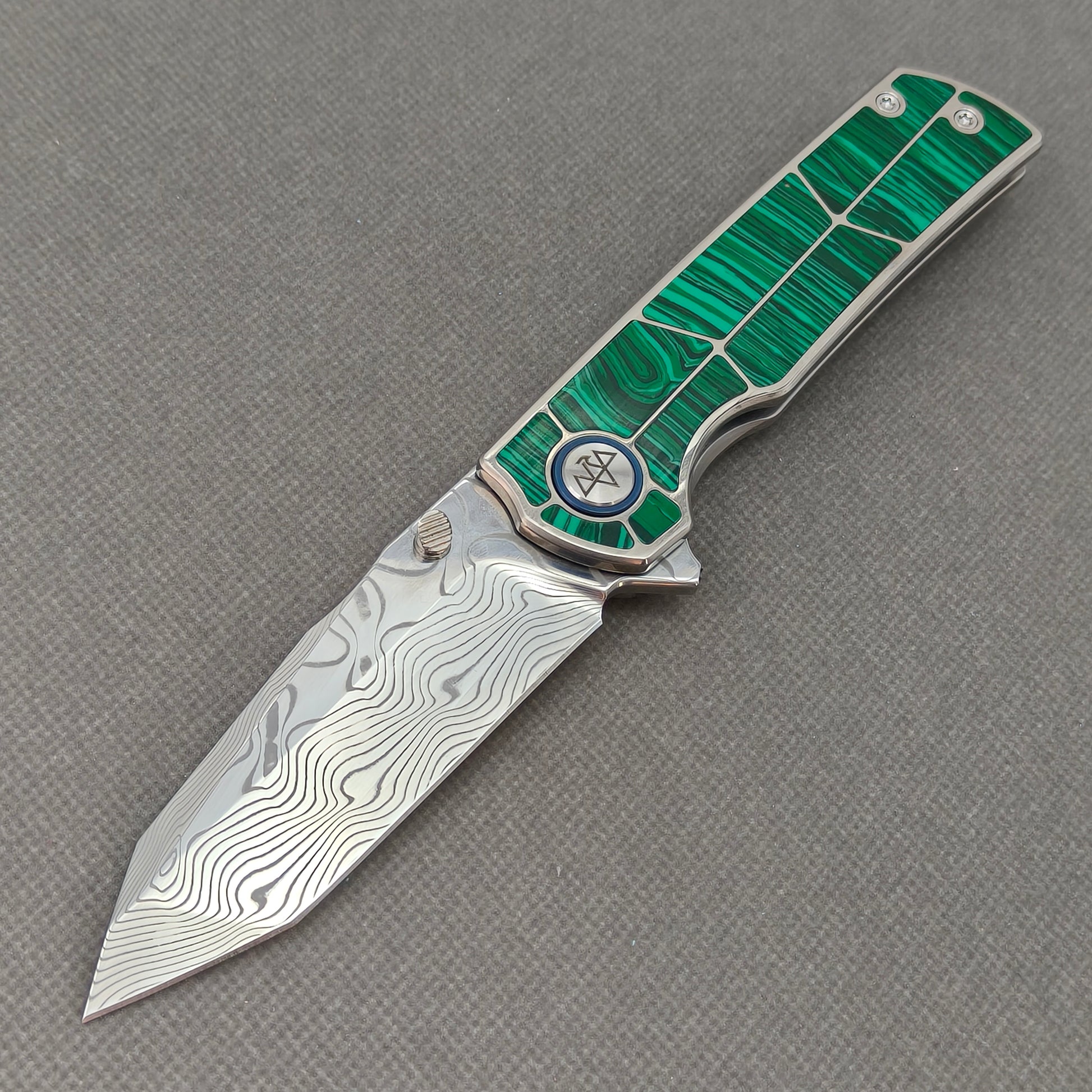 VORIXN KB062 Forest Mirage Damascus folding knife open non-clip side view with malachite inlaid titanium handle and overall profile.