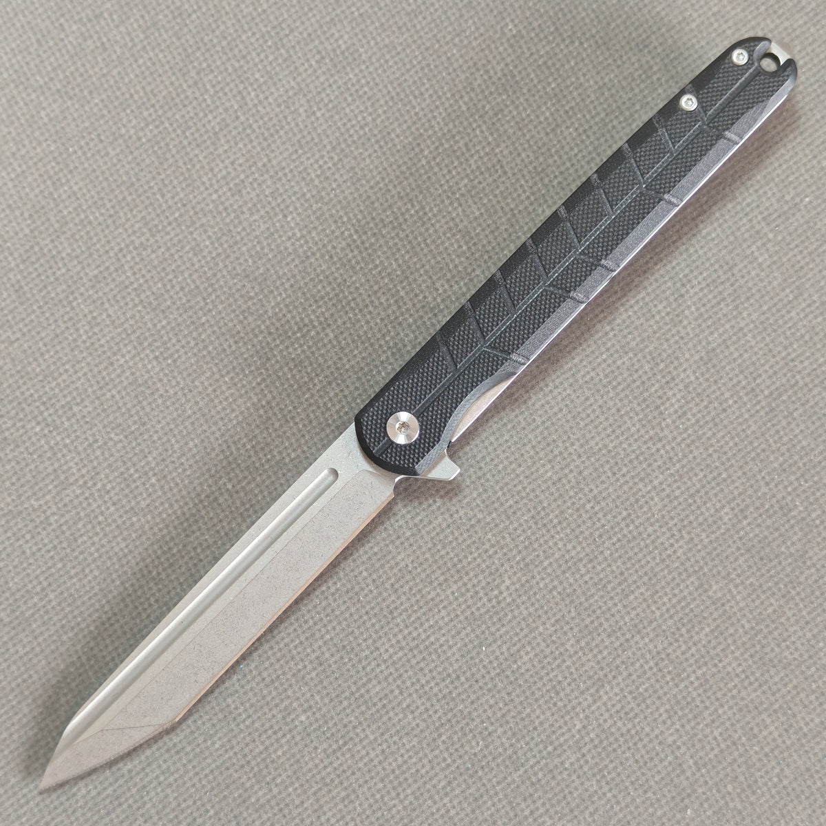 VORIXN KM001 D2 carbon fiber folding knife open non-clip side view with stonewashed blade, handle, and overall profile.