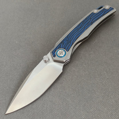 VORIXN KB005 10Cr15CoMoV titanium and G10 folding knife open non-clip side view with blade, handle, and overall profile.