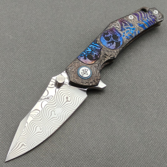 VORIXN “Skull Rift” Flipper & Thumb Stud Knife Titanium-Engraved Anodized Coloring Handle (3.5" Damascus Blade) KB096