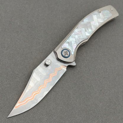 VORIXN KB068 Ocean Mirage Cu-Mai folding knife open non-clip side view with white mother-of-pearl inlaid titanium handle and overall profile.