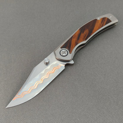 VORIXN KB074 Ironwood Crest Cu-Mai folding knife open non-clip side view with titanium and desert ironwood handle and overall profile.