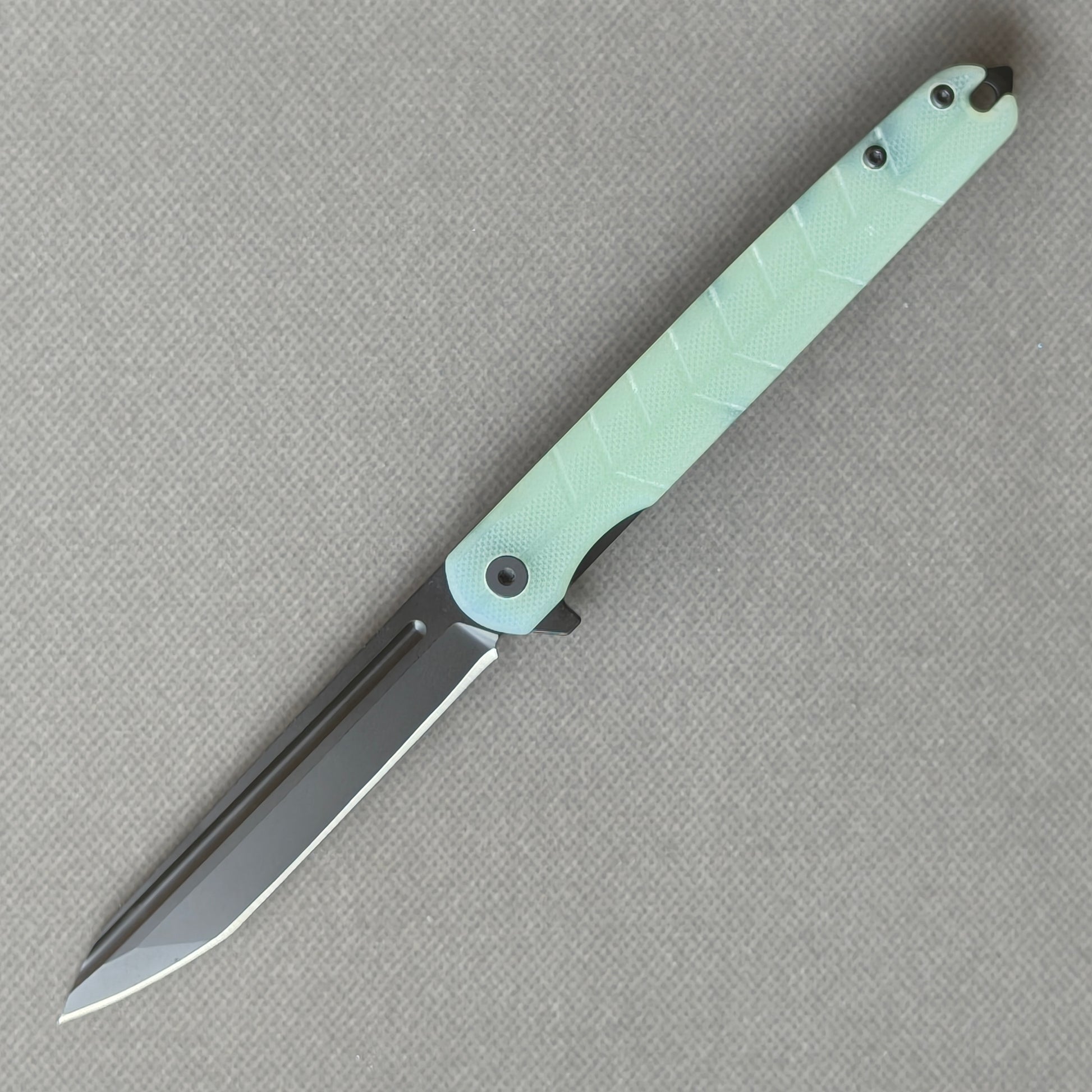 VORIXN KM004 D2 carbon fiber folding knife open non-clip side view with stonewashed blade, handle, and overall profile.