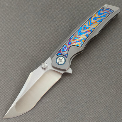 VORIXN KB030 Abyssal Folding Knife – open non-clip side view showing Titanium and Hand-flamed Zirconium handle with 10Cr15CoMoV blade