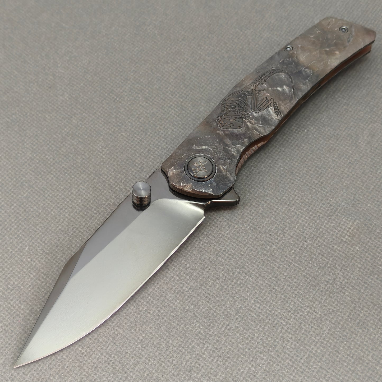 VORIXN Rex KB119 Folding Knife – open non-clip side view showing hand-engraved titanium handle and M390 blade profile