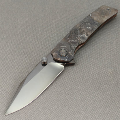 VORIXN Rex KB119 Folding Knife – open non-clip side view showing hand-engraved titanium handle and M390 blade profile