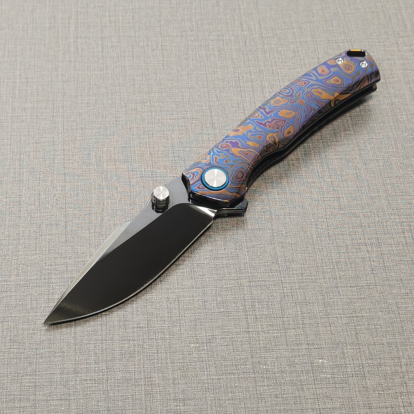 VORIXN Topograph folding knife open from non-clip side, blade angled downward at 45 degrees