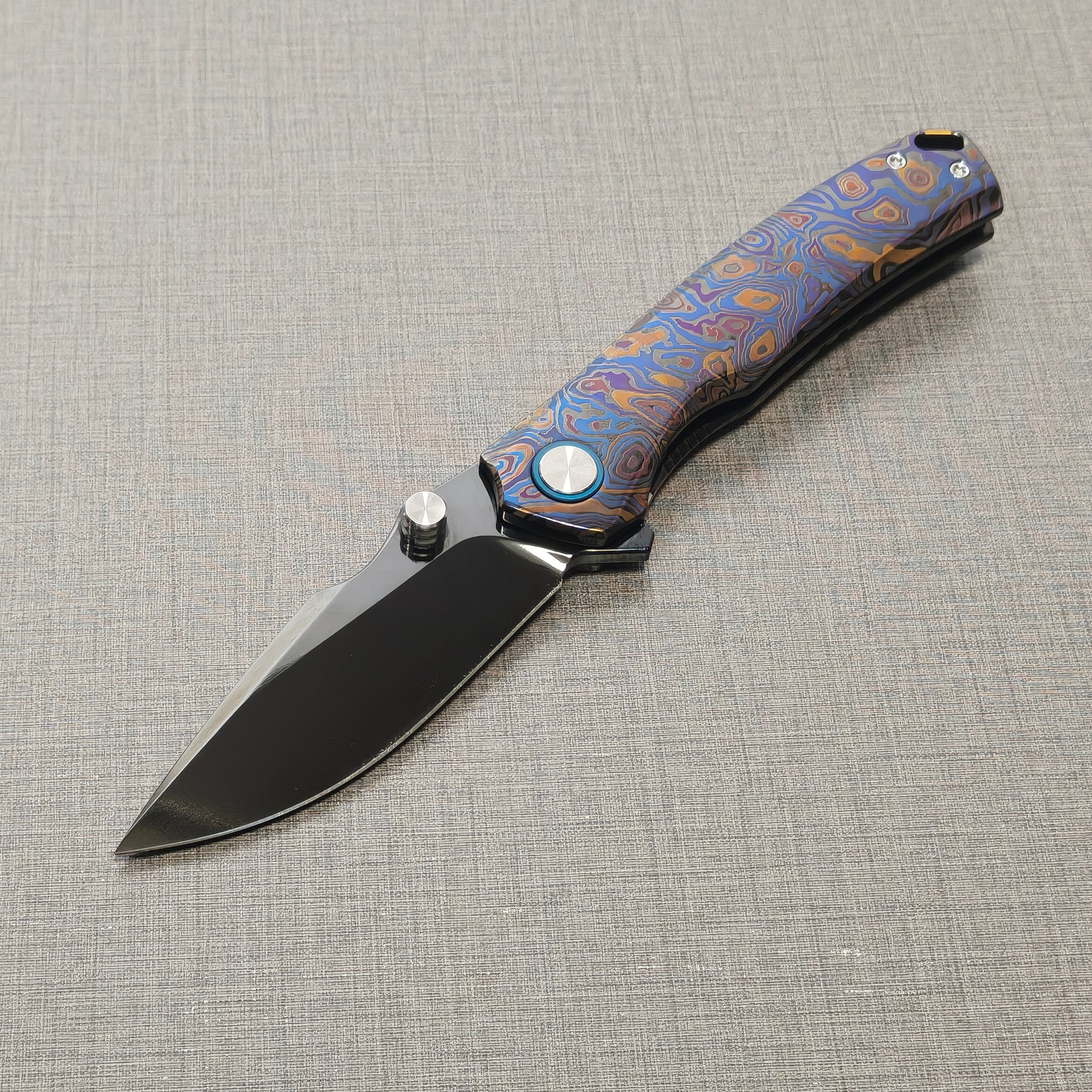 VORIXN Topograph folding knife open from non-clip side, blade angled downward at 45 degrees