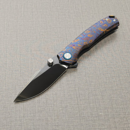 VORIXN Topograph folding knife open from non-clip side, blade angled downward at 45 degrees