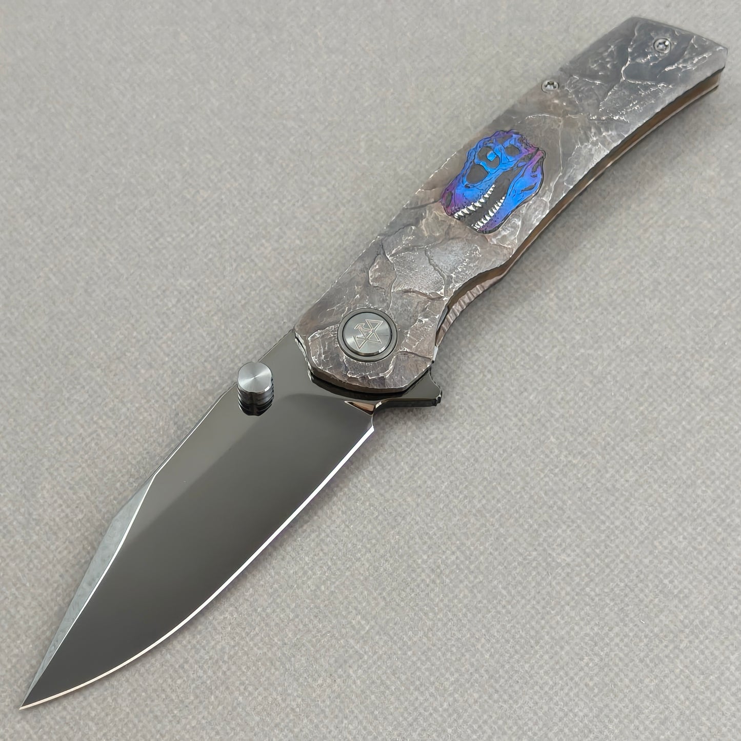 VORIXN Rex KB118 Folding Knife – open non-clip side view showing hand-engraved anodized titanium handle and M390 blade profile