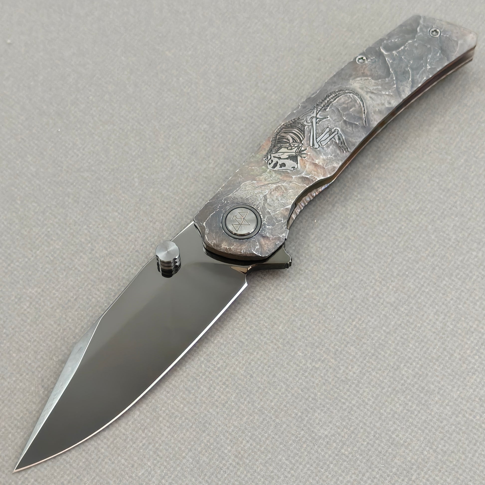 VORIXN Rex KB119 Folding Knife – open non-clip side view showing hand-engraved titanium handle and M390 blade profile