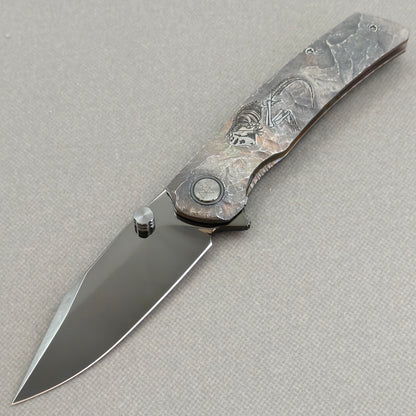 VORIXN Rex KB119 Folding Knife – open non-clip side view showing hand-engraved titanium handle and M390 blade profile
