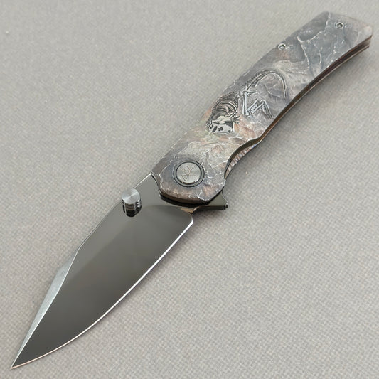 VORIXN Rex KB119 Folding Knife – open non-clip side view showing hand-engraved titanium handle and M390 blade profile