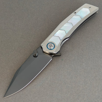 VORIXN Pearlcrest KB158 Folding Knife – open non-clip side view showing dark blade and geometric mother-of-pearl inlays.