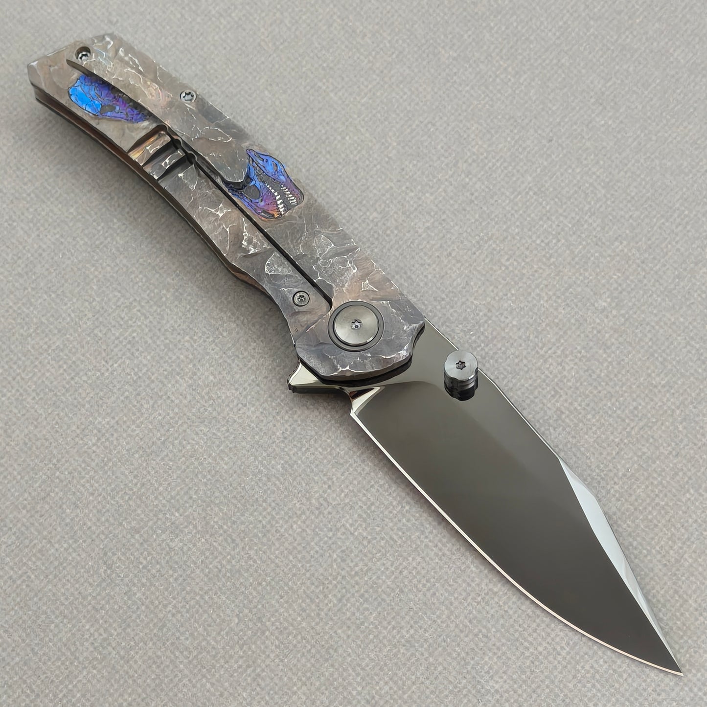 VORIXN Rex KB118 Folding Knife – open clip side view showing pocket clip and hand-engraved anodized titanium handle