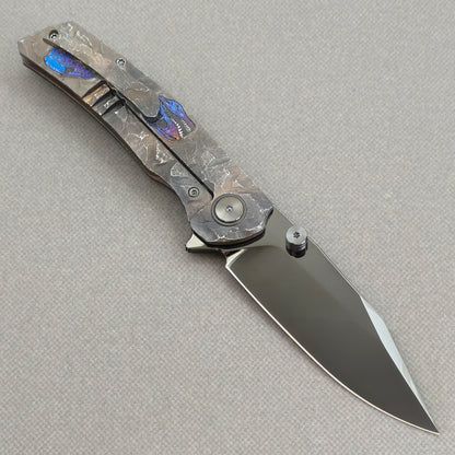 VORIXN Rex KB118 Folding Knife – open clip side view showing pocket clip and hand-engraved anodized titanium handle