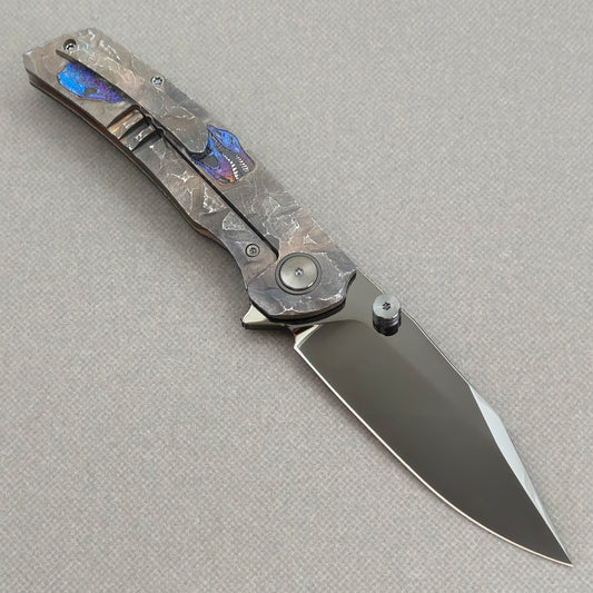 VORIXN Rex KB118 Folding Knife – open clip side view showing pocket clip and hand-engraved anodized titanium handle