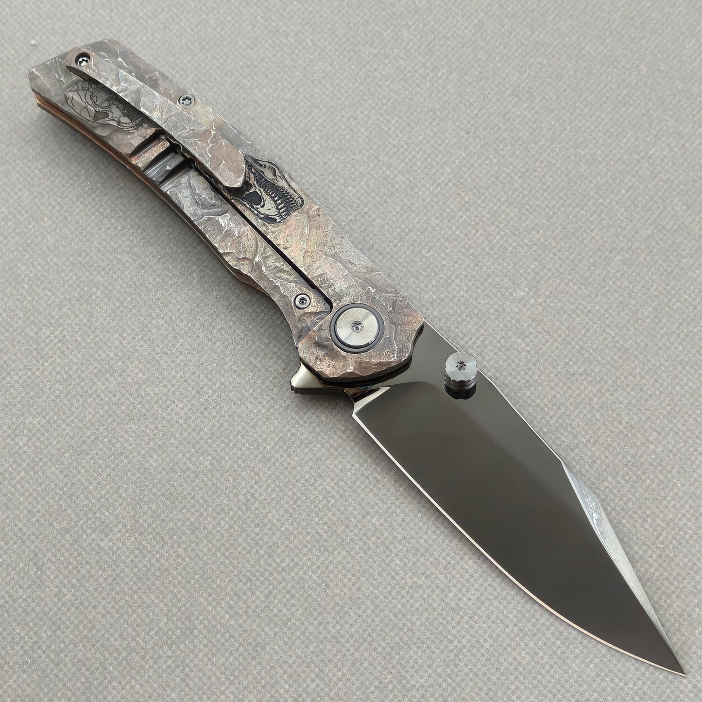 VORIXN Rex KB119 Folding Knife – open clip side view showing pocket clip and hand-engraved titanium handle