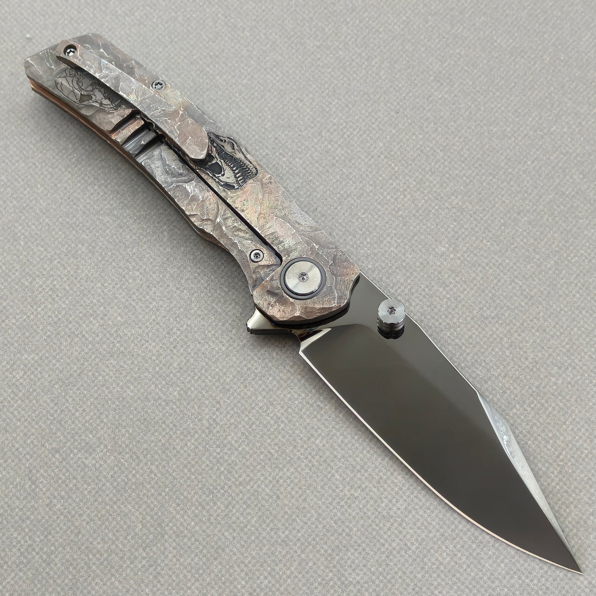VORIXN Rex KB119 Folding Knife – open clip side view showing pocket clip and hand-engraved titanium handle