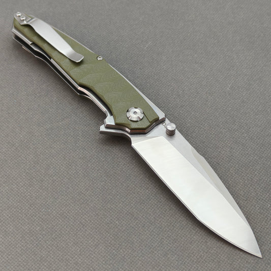 VORIXN KA007 open clip-side view showing pocket clip, forest green G10 handle, and overall profile.