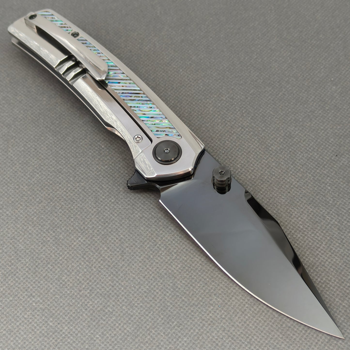 VORIXN KB103 Ocean Mirage Folding Knife – open clip side view showing pocket clip and Iridescent Mother-of-Pearl Inlaid Titanium handle