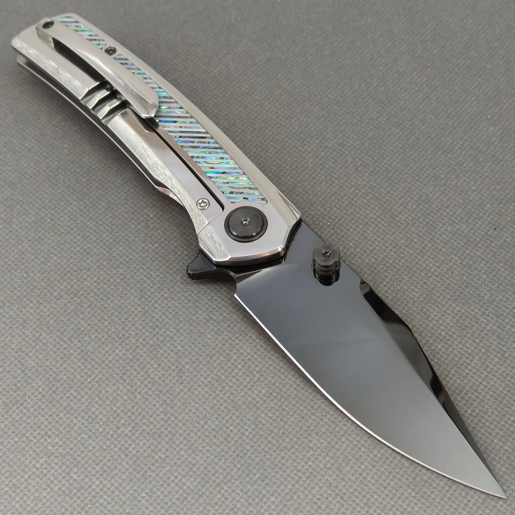 VORIXN KB103 Ocean Mirage Folding Knife – open clip side view showing pocket clip and Iridescent Mother-of-Pearl Inlaid Titanium handle